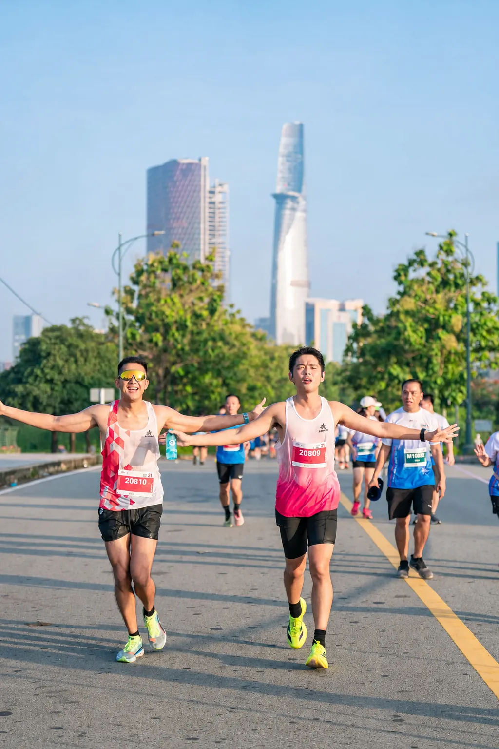 Runner celebrating on the Vinh Long Marathon bridge
