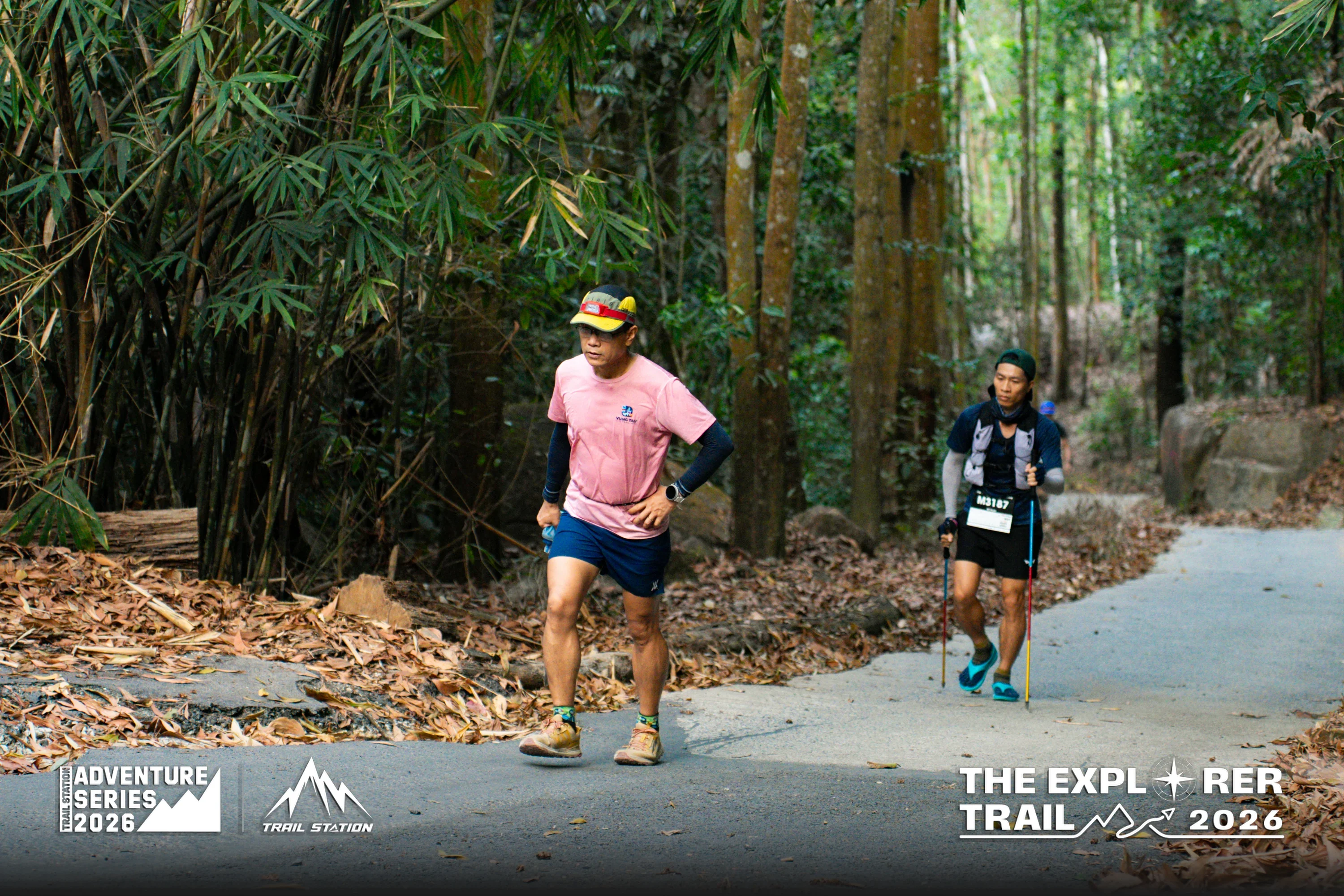 Runners passing through a bamboo forest on The Explorer Trail